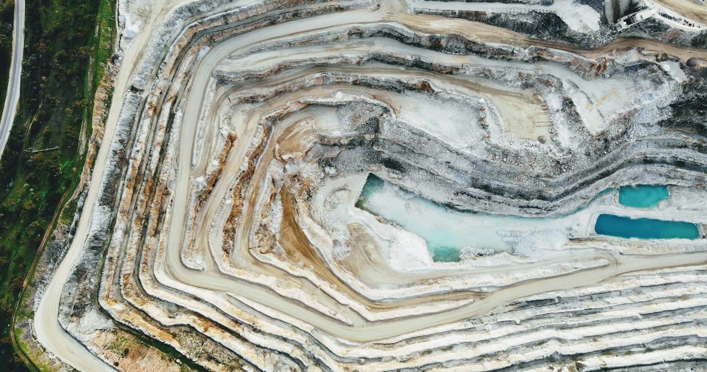 Aerial view of a terraced mineral quarry